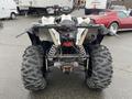 A 2017 Polaris Scrambler ATV with large rear tires and a distinctive rear design featuring dual exhausts and a sturdy suspension system