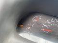 Dashboard of a 2002 Ford F-550 showing fuel gauge near empty and warning light illuminated indicating an issue with the vehicle