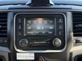 Dashboard display of a 2015 RAM 4500 featuring a touchscreen radio, control knobs, and various audio settings with a digital clock showing 10:56
