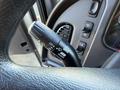 A close-up of a black multifunction turn signal lever from a 2017 Freightliner M2 106 showing various control settings and a textured grip