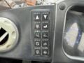 Dashboard controls of a 2018 Doosan DL300 -5 featuring various buttons for functions like elevation and engine status indicators