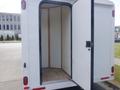 A 2004 Royal 18 Foot Office Trailer with an open door revealing an empty interior featuring wooden trim and flooring