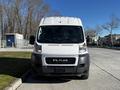 A white 2019 RAM Promaster van facing forward with a prominent RAM logo on the front grille and a flat windshield