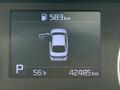 A display screen showing a 2021 Kia Forte with an open door fuel level at 583 kilometers and odometer reading 42485 kilometers with a temperature of 56 degrees Fahrenheit