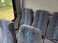 Interior seats of a 2020 Chevrolet Express with gray fabric and colorful abstract patterns