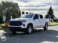 A 2024 Chevrolet Silverado 1500 pickup truck in white with a sleek exterior and modern design featuring a prominent front grille and stylish alloy wheels.