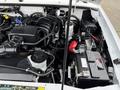 2011 Ford Ranger engine compartment showing the engine components battery and various cables