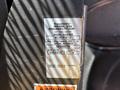 A 2016 RAM Promaster vehicle with a BraunAbility modification label showing model number and specifications