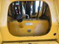 Close-up view of the engine compartment of a 2013 JCB 510-56 Loadall with hydraulic lines and components visible