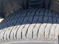 Close-up of a tire from a 2016 Ford F-350 SD showing detailed tread patterns and rubber texture