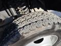 Close-up of a tire from a 2014 Ford F-550 showing tread pattern and details of the wheel design