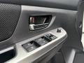 Close-up of the power window controls and door handle of a 2016 Subaru Crosstrek