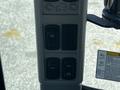 Control panel of a 2018 New Holland Boomer 45 featuring several buttons for various functions including lights and other equipment controls