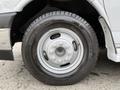A close-up of the wheel and tire of a 2019 Chevrolet Express showing the silver rim and black tire with a specific size of 225 75 R16