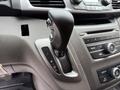 The gear shift of a 2014 Honda Odyssey with markings for park reverse neutral drive and low