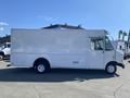 A white 2012 Ford Econoline box truck with a flat front and large cargo area visible from the side