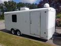 A white 2004 Royal 18 Foot Office Trailer with a single door and an air conditioning unit on the roof