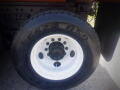 A close-up view of a 2016 International WorkStar 7500 truck tire with a white rim and black tread pattern showing the model number G622 RSD