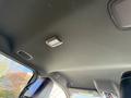 Interior view of a 2023 RAM 3500 showing the ceiling with a light fixture and upholstery details