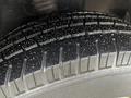 Close-up of a tire from a 2021 Mercedes-Benz Sprinter showing the tread pattern and surface details