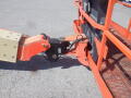 Close-up of the arm and platform attachment of a 2008 JLG Boom Lift showcasing the hydraulic mechanism and connection point