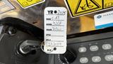 A 2018 Caterpillar 326F L Excavator identification tag displaying details such as the make model and color