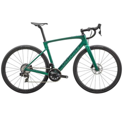 A 2024 Specialized Roubaix SL8 Pro road bike in a vibrant green color featuring a sleek design disc brakes and aerodynamic frame