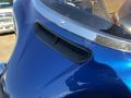 Close-up of the front of a blue 2017 Harley-Davidson FLHXS featuring a sleek design and an air vent on the outer edge