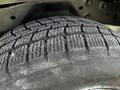 Close-up of a tire from a 2010 Ford Ranger showing tread patterns and texture