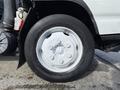 Close-up of a white wheel on a 2007 GMC W5500 18 foot cube van showing the tire tread and rim details