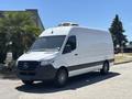 A 2019 Mercedes-Benz Sprinter van with a white exterior and black trim parked on a street
