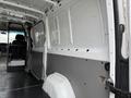 Interior view of a 2016 Mercedes-Benz Sprinter van showing the cargo area with exposed walls and flooring