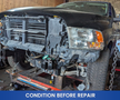 A 2019 RAM 1500 Classic with its front end disassembled and missing parts is on display in a repair setting