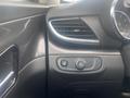 Interior dashboard of a 2018 Buick Encore featuring controls for lights and air vents