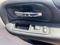Interior door handle and window control panel of a 2020 Dodge Grand Caravan