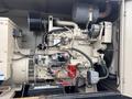 A 2005 Katolight SED60FPJ4 generator with an engine and various components including wiring and a battery visible in the foreground