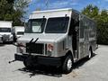 A 2008 Morgan Olson Workhorse delivery truck with a silver exterior featuring large front windows and various attachments on the side