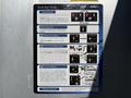 A 2024 Ford F-550 with a Quick Start Guide displayed on a metallic surface detailing instructions for operation and features