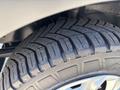 Close-up of a tire from a 2016 Ford Transit showing a detailed tread pattern and alloy rim