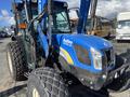 A blue 2010 New Holland T4050 tractor featuring a front loader and large rear tires designed for agricultural use