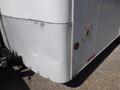 A 2004 Royal 18 foot office trailer with a diamond plate corner and a side panel featuring a light and a small access panel