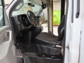 Interior view of a 2020 Chevrolet Express showing the driver's seat dashboard and steering wheel