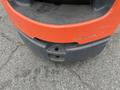 2011 Toyota Forklift with a red and gray front section showing wear and a tow hitch attachment point