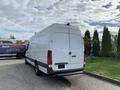 A white 2019 Mercedes-Benz Sprinter van with a tall rear and dark accents parked in a lot