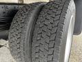 Close-up of two worn tires from a 2019 Hino 195 showing detailed tread patterns and sidewall design