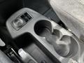 Cup holder and 12V outlet in the center console of a 2016 Ford Transit Connect