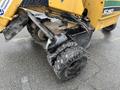2014 Vermeer Corporation Sweep Stump Cutter with rugged tires and a robust cutting mechanism visible in the foreground