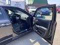 2019 Dodge Charger with the driver's side door open revealing the interior dashboard and seats