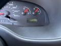 Dashboard of a 2008 Ford E-350 displaying the speedometer fuel gauge and odometer reading 130700 miles
