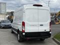A white 2022 Ford Transit van viewed from the rear with the model name TRIT 250 displayed on the back